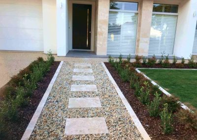 Not only do we specialise in instant and synthetic lawns, we also provide paving services - This suburban Adelaide client opted for a central paving in gravel pathway for their front entrance